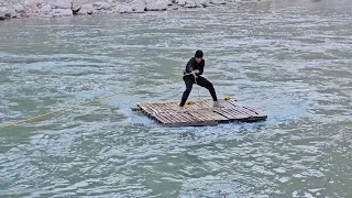 Risky Journey: Nomads Crossing the River and Traversing Dangerous Rocks to Reach a Cave