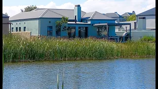 Waterfront tranquility on Atlantic Beach Golf Estate in Cape Town. For sale by Morris Pieterse.