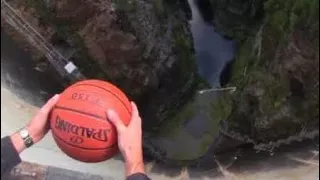 What Happens When a Spinning Basketball is Thrown Off a Dam!