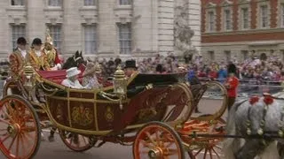 Royal procession: Queen travels by horse and carriage through the streets of London