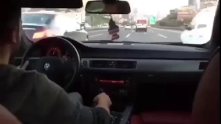 Crazy BMW driver running into traffic