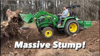 Digging up a massive stump with a John Deere 3025e 25hp