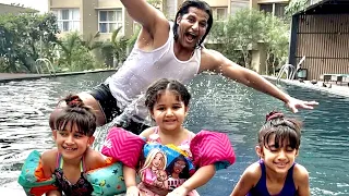 Dad does an amazing trick while babies pose in the swimming pool! 😄