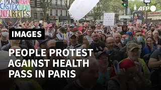 People demonstrate against the health pass in Paris | AFP