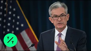 Fed Holds Interest Rates Steady, Hints at Future Cuts