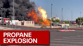 Explosions seen as large fire burns at Phoenix propane business