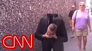 Distraction: Magician sneezes his head off