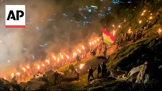 Iraqi Kurds celebrate Newroz by carrying torches and fireworks