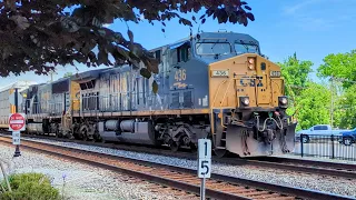 Southbound CSX autorack with a few auto parts boxcars on track two