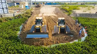 Bulldozer Shantui with Many Dumps Truck 25T unloading Soil Starting New Project Build Road on Water