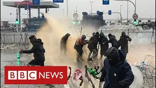 Water canon and tear gas used on migrants at Belarus-Poland border - BBC News
