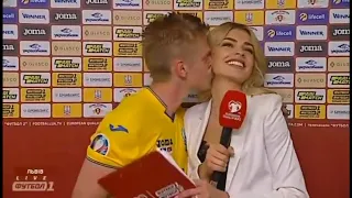 A footballer (Zinchenko) kissed a female reporter after his national team (Ukraine) won over Serbia!