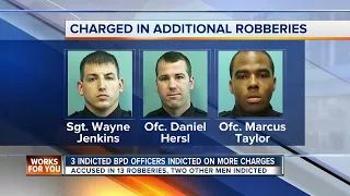 3 previously indicted police officers face additional robbery charges