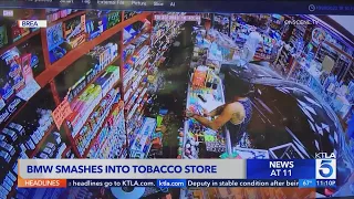 Security footage shows vehicle crash into tobacco store in Brea