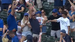 Fan makes INCREDIBLE catch while holding kid!