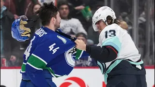 Kyle Burroughs and Brandon Tanev drop the gloves