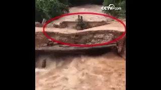 Two people fall into flood as bridge collapses| CCTV English