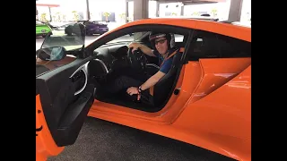 Allen drives an Acura NSX