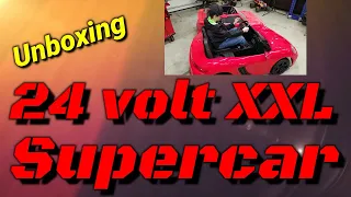 GIANT 24 volt Powerwheels unboxing- XXL rubber tire super car #bigtoysgreencountry.com