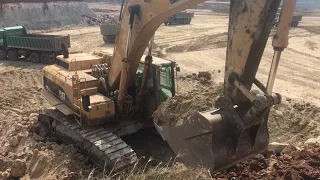 Caterpillar 365B Excavator Loading Trucks