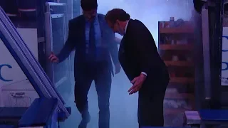 John Tortorella slips while walking out to the bench