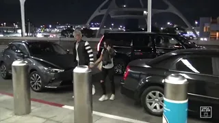 Machine Gun Kelly and his girlfriend Megan Fox walking with hand-to-hand at LAX