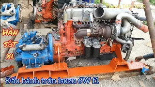 Ghép nối động cơ isuzu 6w f1 hộp số 135a 4,5:1 và hàn sắt xi chân máy