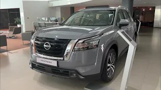 Nissan pathfinder 2023 gray and red color in uae showroom