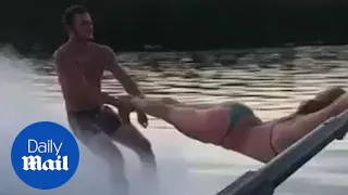 Hilarious moment man uses woman as rope for water ski stunt - Daily Mail