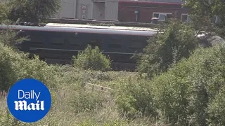 Two railway workers die after being hit by a train in South Wales