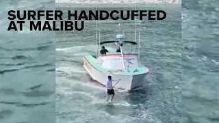 SUP Surfer Handcuffed for Surfing Empty Malibu  - The Inertia