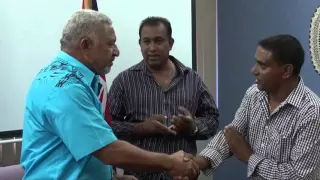 Fijian Prime Minister Voreqe Bainimarama, receives donations