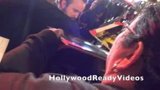 Aaron Paul greets fans arrivng at the Need For Speed premiere in Hollywood