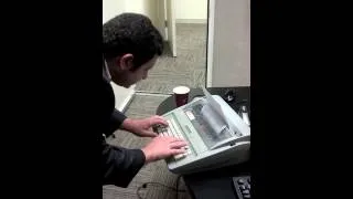 Frank Morano tests out a typewriter.