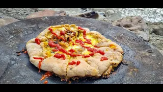 Cooking Campfire Pizza at Sadj Grill, the best pizza you'll ever eat