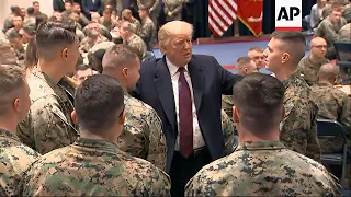 Trump visits Marines who recently helped DC fire