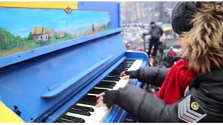 The Maidan Piano takes on the Police Boombox. February 10, 2014. Kyiv, Ukraine.