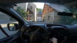 Taking a detour road to Alpe d'Huez due to Tour de France. Renault Trafic. POV. Summer. Morning Alps