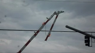 2 Trains Go Through Railroad Crossing With Hinged Gates