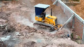 Nice New Projects Push The Ground Near The Fence Using Mini Bulldozer And Truck Spreading
