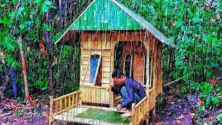 solo camping in heavy rain repeatedly while building a simple shelter