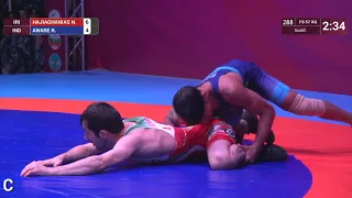 Qual. FS - 57 kg: N. HAJIAGHANIAS (IRI) v. R. AWARE (IND)