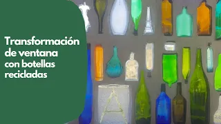 Creación de una pared con botellas de vidrio recicladas y de colores.