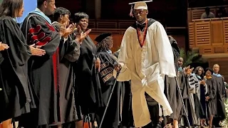 Paralyzed grad surprises crowd by walking on graduation day