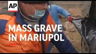 GRAPHIC: Bodies buried in mass grave in Mariupol