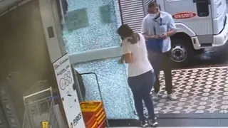 Woman Accidentally Shatters Store's Glass Door