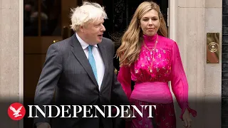 Boris and Carrie Johnson applauded as they leave Downing Street for final time