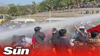 Myanmar coup - police water cannon-protesters