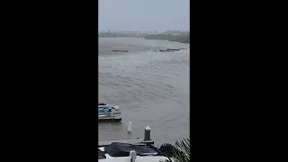 Debris flows through flooded area of Naples as Hurricane Ian moves over Florida