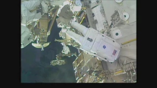 Space Station Crew Members Conduct a Spacewalk for Battery Replacement on the Outpost